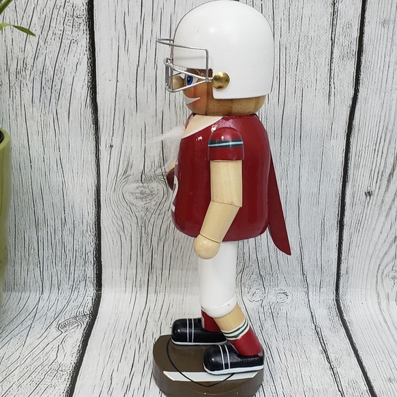 Wooden 9" Nutcracker w/ Helmet & Holding Football - Picture 2 of 9